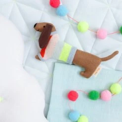 Meri-Meri Sausage Dog Baby Rattle -Meri Meri media b372f166 d4f9 4f4e b777 95ee34d8500f